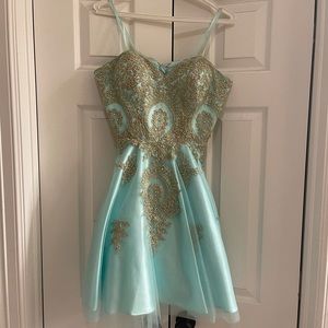 Turquoise and gold strapless dress from Camilles.